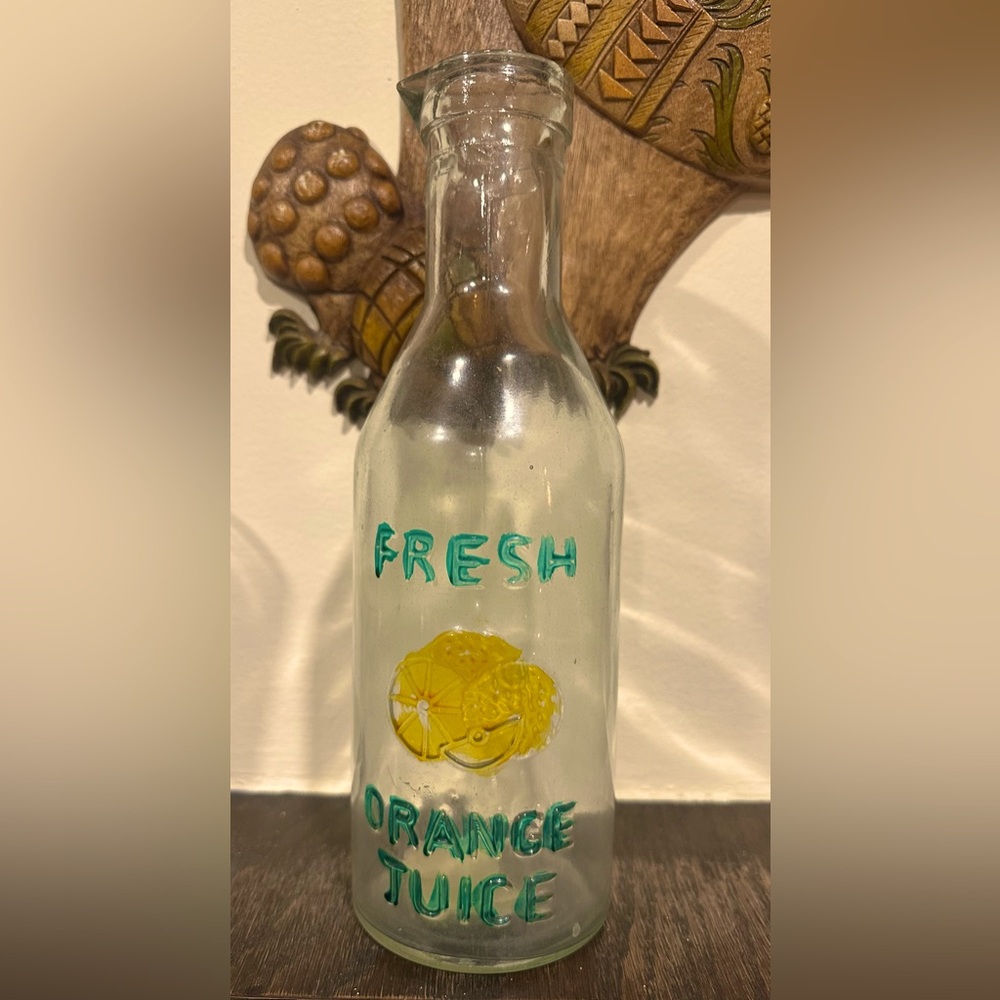 Vintage Glass Bottle with Fresh Orange Juice Design